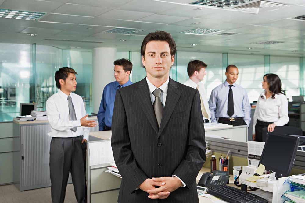 Businessman and office workers